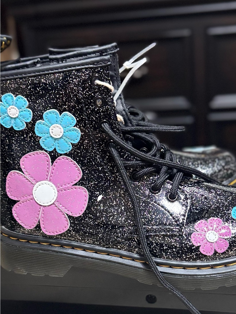 Dr. Martens Black Glitter Lace-Up Kids Boots with Pink & Blue Flower Patches,
